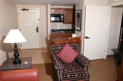 Kitchenette and chair in living room